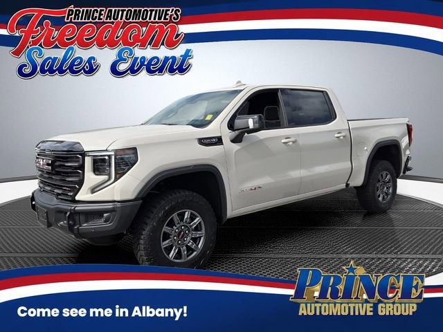 2026 GMC Sierra 1500 AT4X in Coastal Dune — front three-quarter view